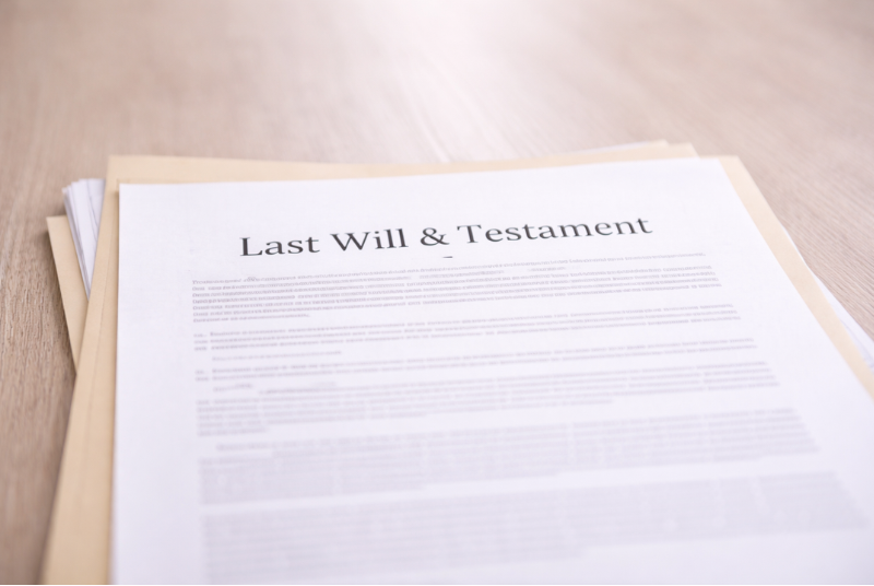 last will and testament document on estate paperwork stack